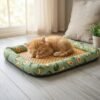 petzvibes-natural-rattan-cooling-pet-bed-mat-size-s-kitten-avocado-print-lifestyle.jpg Tiny ginger kitten sleeping on the PetzVibes Size S Natural Rattan Cooling Pet Bed Mat in Avocado Print on light hardwood floor in a bright home interior