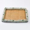 petzvibes-natural-rattan-cooling-pet-bed-mat-avocado-print-studio.jpg PetzVibes Natural Rattan Cooling Pet Bed Mat for dogs and cats in Avocado Print design — studio product photo showing natural golden-honey woven rattan center and padded sage green Oxford fabric border