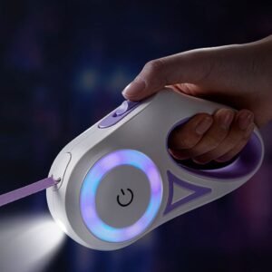 Hand holding a purple and white LED retractable dog leash with glowing purple ring light and spotlight on a suburban path at night