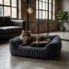 plush-ribbed-calming-pet-bed-cats-dogs-dark-grey-maine-coon-industrial-loft.jpg Maine Coon cat resting in a PetzVibes dark grey plush ribbed calming pet bed on a polished concrete floor in a modern industrial loft apartment