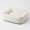 plush-ribbed-calming-pet-bed-cats-dogs-white.jpg PetzVibes Plush Ribbed Calming Pet Bed for cats and dogs in off-white cream, square bolster sofa bed with channel-stitch plush fabric and dark non-slip base
