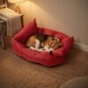 3in1-pet-bed-red-bed-mode-lifestyle-dog-1080x1080 Beagle sleeping curled up in a red 3-in-1 convertible pet bed in enclosed bed mode in a cozy bedroom
