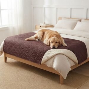 Golden retriever resting on a Maroon Anti-Leakage Waterproof Dog Bed Cover draped over a bed in a cozy bedroom